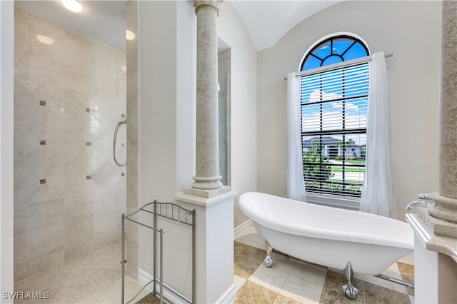 bathroom with independent shower and bath, tile patterned flooring, and a wealth of natural light