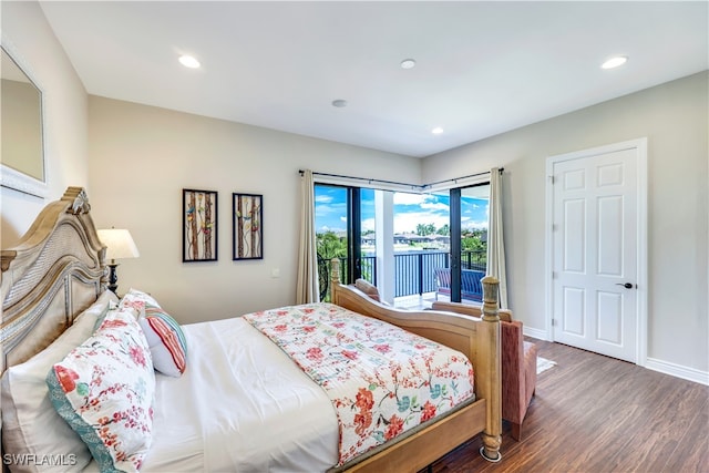 bedroom featuring hardwood / wood-style flooring and access to exterior