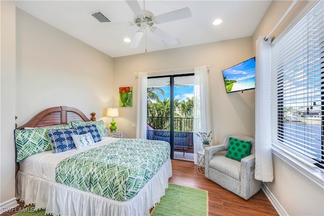 bedroom featuring ceiling fan, access to exterior, and hardwood / wood-style flooring