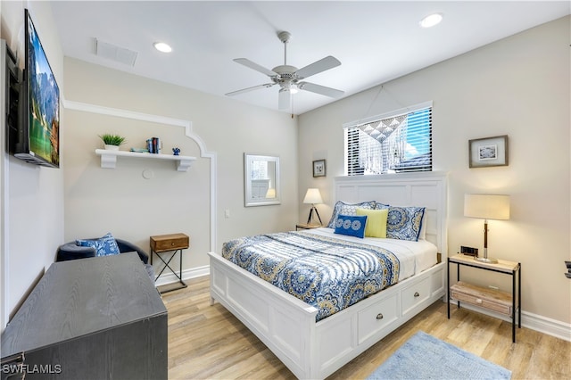 bedroom featuring ceiling fan and light hardwood / wood-style flooring