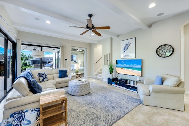 living room featuring beam ceiling, ceiling fan, and light tile patterned floors