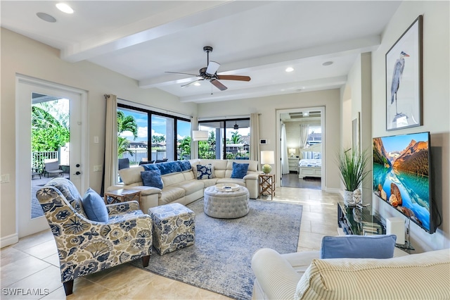 tiled living room with ceiling fan, beamed ceiling, and a wealth of natural light