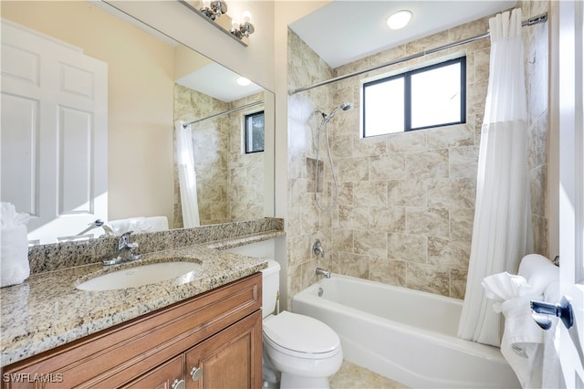 full bathroom with vanity, toilet, and shower / bath combo