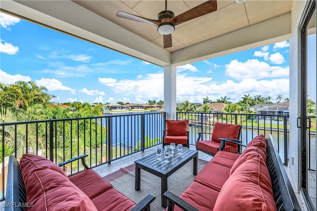 balcony with ceiling fan and an outdoor living space