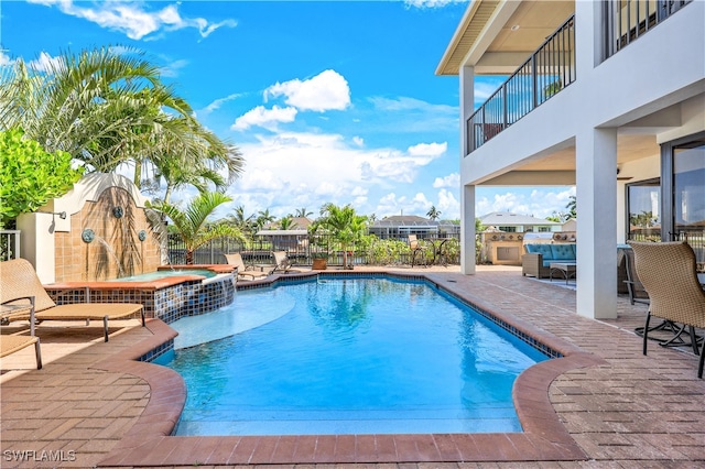 view of pool featuring ceiling fan and a patio