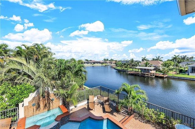 view of swimming pool with a water view