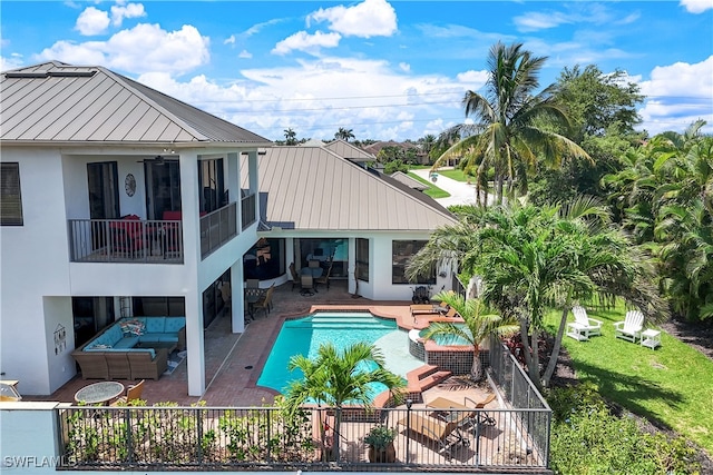 view of swimming pool featuring ceiling fan, a patio, and an outdoor hangout area