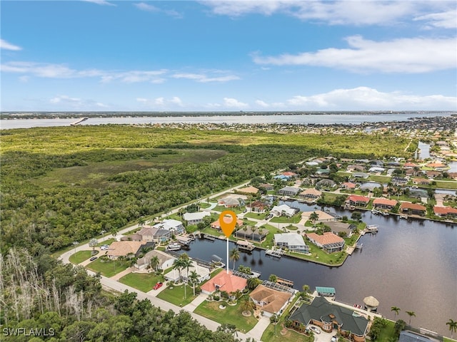 drone / aerial view with a water view