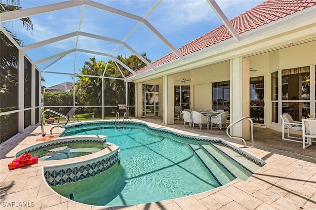 view of pool featuring an in ground hot tub, a patio, ceiling fan, and a lanai