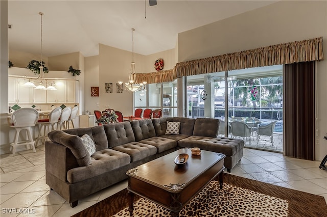 living room featuring a chandelier, high vaulted ceiling, and light tile patterned flooring