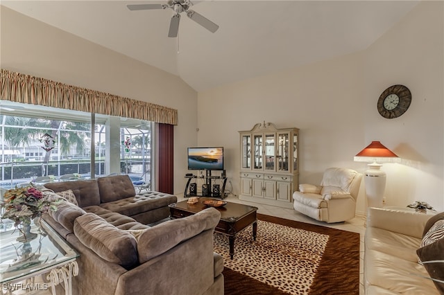 tiled living room featuring ceiling fan and vaulted ceiling