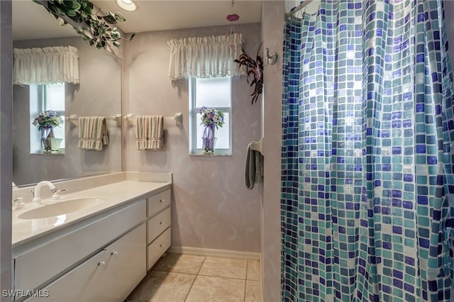 bathroom featuring vanity, tile patterned floors, and a wealth of natural light