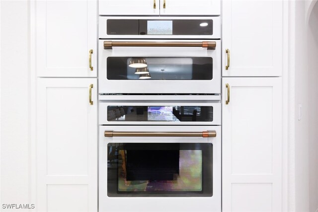 kitchen featuring double wall oven and white cabinets