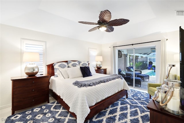 bedroom featuring ceiling fan and access to exterior