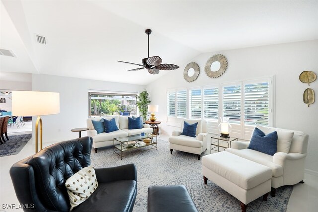 living room featuring ceiling fan and lofted ceiling