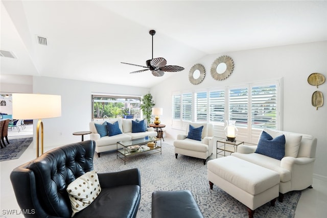 living room featuring ceiling fan and vaulted ceiling