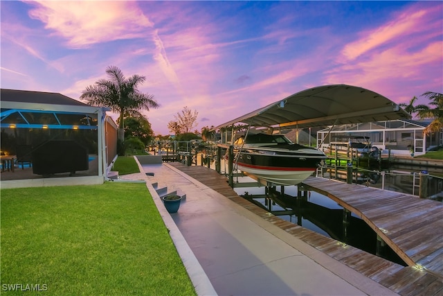 view of dock featuring a yard and a water view