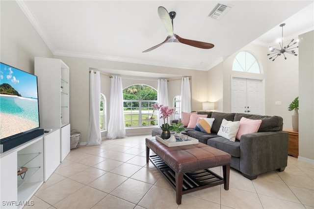 living room featuring ceiling fan with notable chandelier, light tile patterned flooring, and crown molding