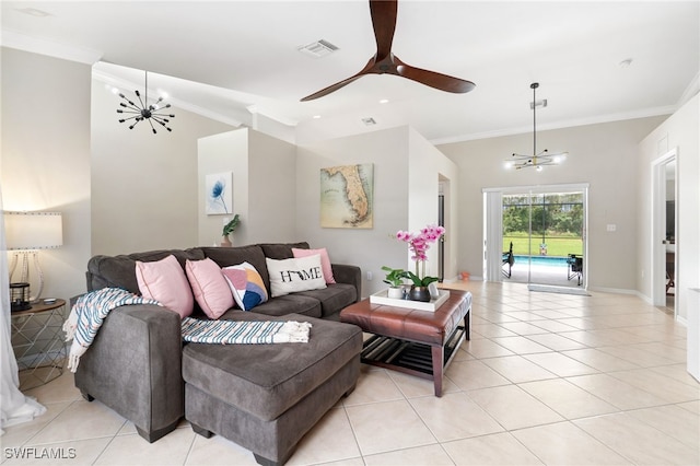 living room with ceiling fan with notable chandelier, light tile patterned floors, and crown molding