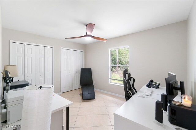 office space featuring ceiling fan and light tile patterned floors