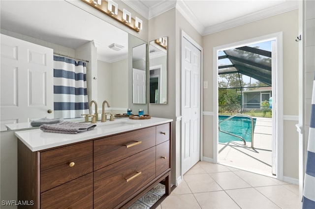 bathroom featuring ornamental molding, tile patterned flooring, and vanity