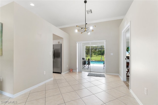 interior space with ornamental molding, a chandelier, and light tile patterned floors