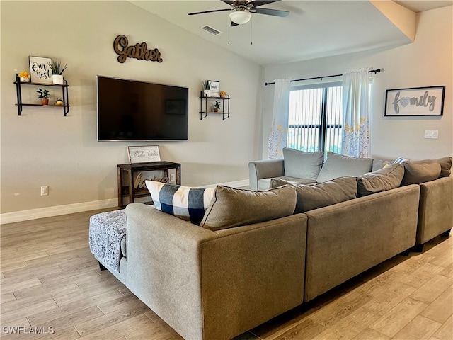 living room featuring light wood-type flooring, vaulted ceiling, and ceiling fan