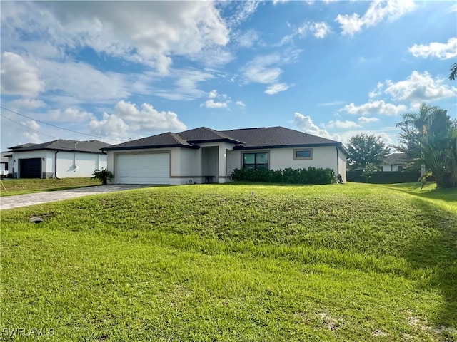 single story home with a garage and a front yard