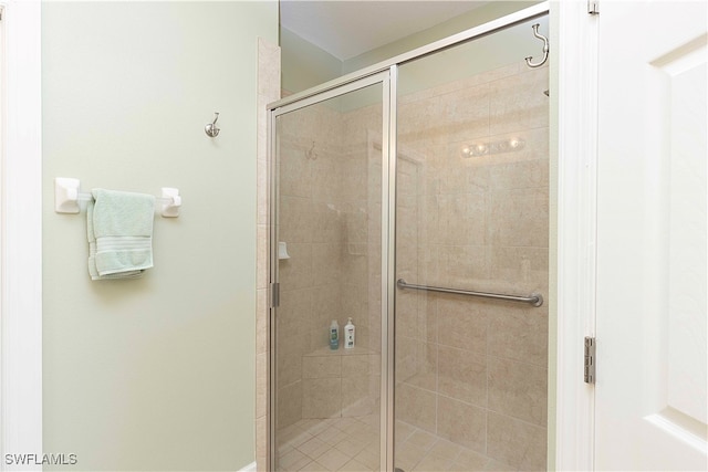 bathroom with a shower with shower door