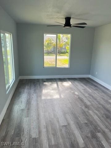 spare room with hardwood / wood-style floors, plenty of natural light, and ceiling fan