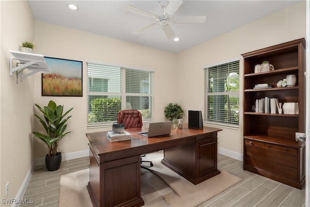 office featuring light wood-type flooring and ceiling fan