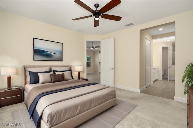 bedroom featuring light carpet and ceiling fan