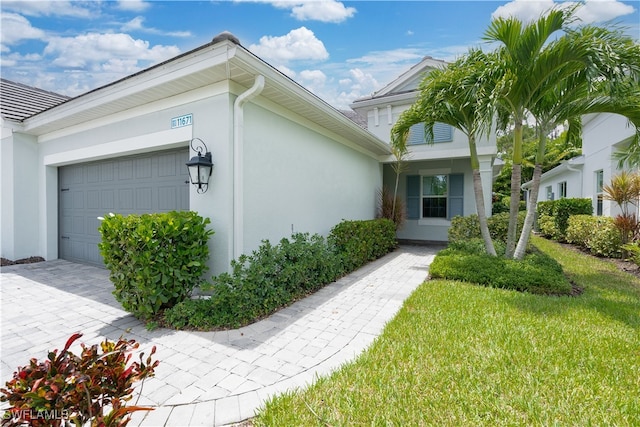 view of side of home featuring a garage