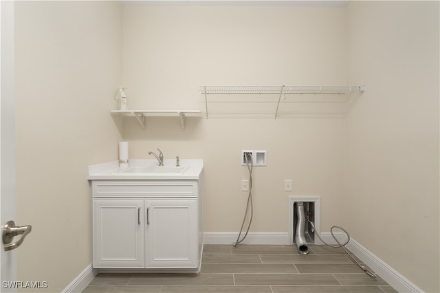 laundry room with hookup for a washing machine and sink