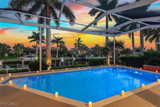 view of pool at dusk