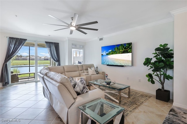 living room with ceiling fan, a water view, light tile patterned floors, and crown molding