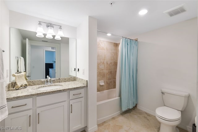 full bathroom with tile patterned flooring, shower / tub combo with curtain, toilet, and vanity