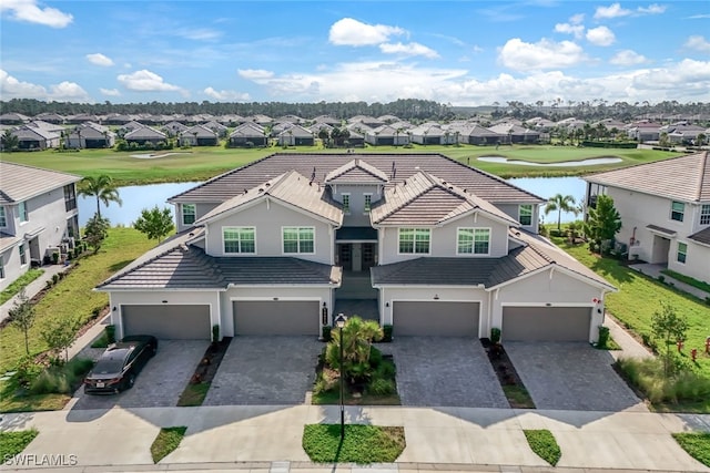 view of front of home featuring a garage and a water view