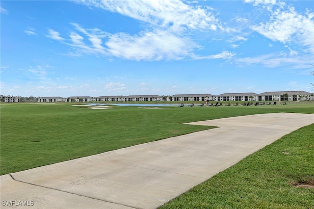 view of property's community with a lawn