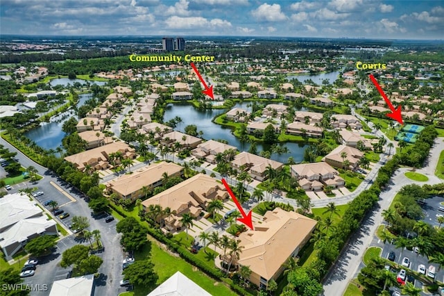 birds eye view of property with a water view