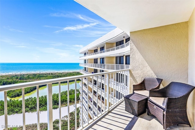 balcony featuring a water view