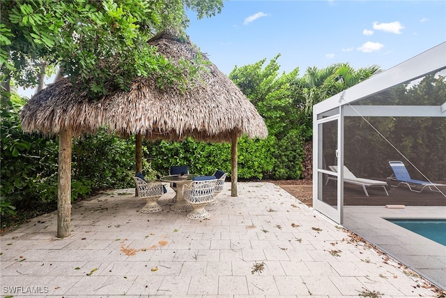 view of patio with a lanai