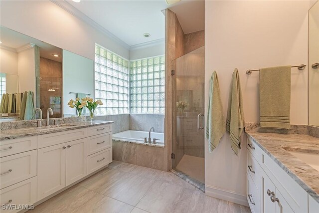 bathroom featuring crown molding, shower with separate bathtub, and vanity