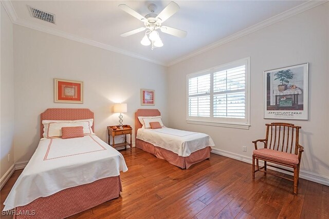 bedroom with ceiling fan, ornamental molding, and hardwood / wood-style floors