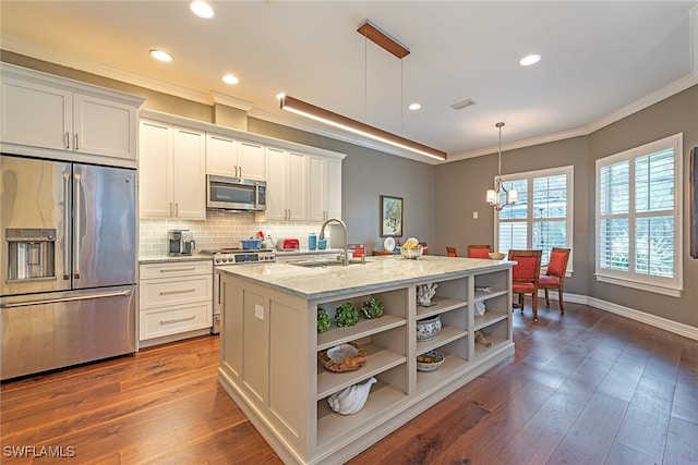 kitchen featuring a kitchen island with sink, dark hardwood / wood-style flooring, light stone counters, and stainless steel appliances