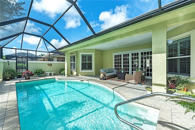 view of swimming pool with a lanai and a patio