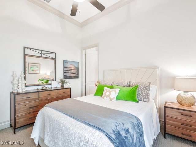 bedroom with baseboards, ornamental molding, a ceiling fan, and light colored carpet