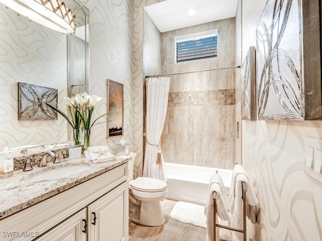 full bath with toilet, shower / bath combo with shower curtain, wood finished floors, and vanity