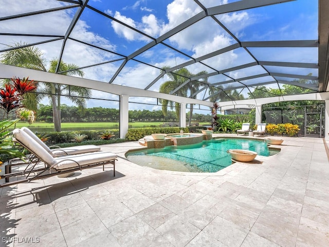 view of swimming pool with a lanai, a pool with connected hot tub, and a patio