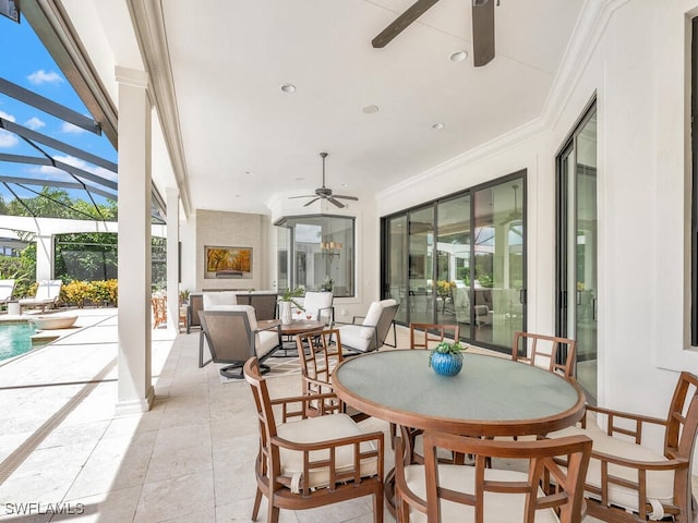 sunroom / solarium featuring a ceiling fan